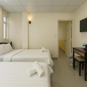 Postel nebo postele na pokoji v ubytování LAM ANH Hotel