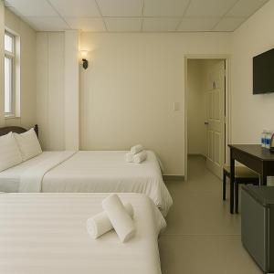 Postel nebo postele na pokoji v ubytování LAM ANH Hotel