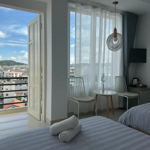Postel nebo postele na pokoji v ubytování LAM ANH Hotel