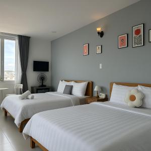 Postel nebo postele na pokoji v ubytování LAM ANH Hotel