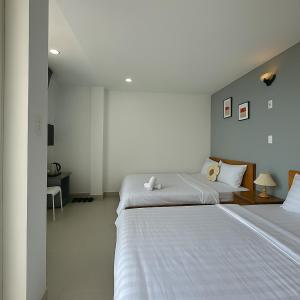 Postel nebo postele na pokoji v ubytování LAM ANH Hotel