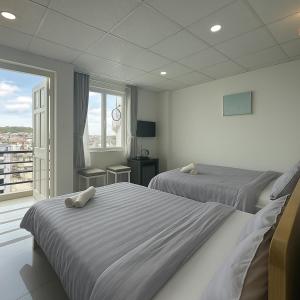Postel nebo postele na pokoji v ubytování LAM ANH Hotel