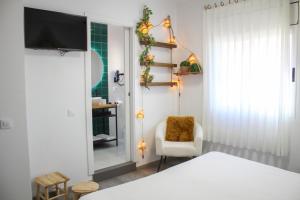 A bed or beds in a room at Hotel Pepo
