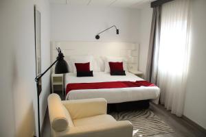 A bed or beds in a room at Hotel Pepo