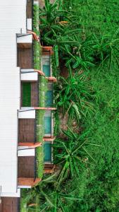 an aerial view of a building with green plants at Baliris Canggu Villa by Betterplace in Tumbak Bayuh