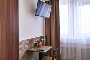 TV a/nebo společenská místnost v ubytování Hotel Maximo