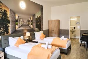 Postel nebo postele na pokoji v ubytování Hotel Maximo