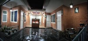 a hallway with a fireplace in a brick building at Family Home in Pātan