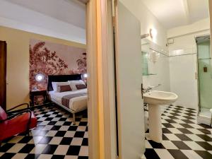 a bedroom with a bed and a sink and a bathroom at Villa Fieschi Boutique Hotel in Lavagna +58 photos