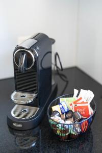 a toaster sitting on a counter with a basket of food at Gartenoase by Greatlifestay in Ennetbürgen +26 photos