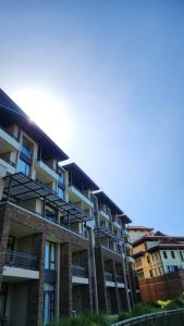 an apartment building with balconies on the side at Zimbali Suites Ocean View Nyambose Villas in Ballito