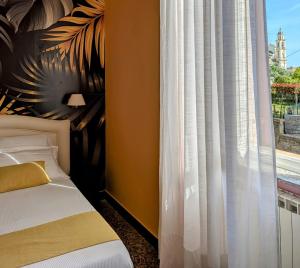 Postel nebo postele na pokoji v ubytování Villa Fieschi Boutique Hotel
