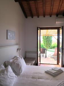 Voodi või voodid majutusasutuse Hotel Il Cipresso toas