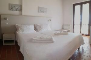 Voodi või voodid majutusasutuse Hotel Il Cipresso toas