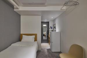 Postel nebo postele na pokoji v ubytování L hostel