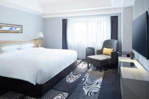 Postel nebo postele na pokoji v ubytování Hotel New Otani Hakata