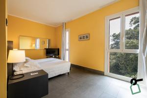 Ένα ή περισσότερα κρεβάτια σε δωμάτιο στο HOTIDAY Room Collection - Arenzano