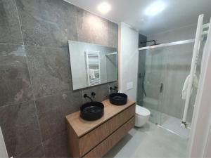 Koupelna v ubytování Apartamentos Ciudadela Superior 3000 + 16 fotografií