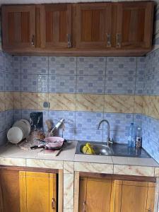 a kitchen with a sink and a counter top at Studio Residence OR Tambo in Kribi +5 photos