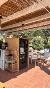 a patio with a table and a wooden pergola at Calanave 10 in Ventotene +66 photos