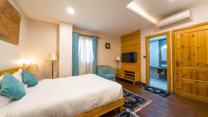 Ένα ή περισσότερα κρεβάτια σε δωμάτιο στο Lalit Service Apartment