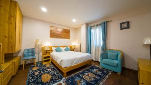 Postel nebo postele na pokoji v ubytování Lalit Service Apartment