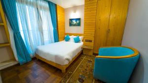 Ένα ή περισσότερα κρεβάτια σε δωμάτιο στο Lalit Service Apartment