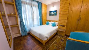 Ένα ή περισσότερα κρεβάτια σε δωμάτιο στο Lalit Service Apartment