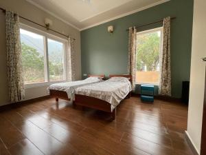 Postel nebo postele na pokoji v ubytování Inaara