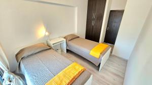 Postel nebo postele na pokoji v ubytování Molos city centre living