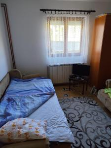 Ένα ή περισσότερα κρεβάτια σε δωμάτιο στο Kaludjerovic