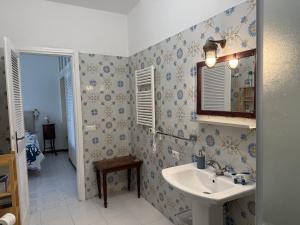 a bathroom with a sink and a mirror at Vista Mare in Porto Santo Stefano