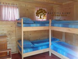 a room with four bunk beds in a cabin at Rafting Campsite Stari Dud in Foča