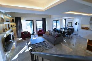 a living room with a couch and a table at Cesme Villa Mona Ovacık luxury villa in Cesme