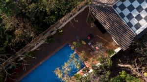 an overhead view of a swimming pool in a backyard at Trezora 3 4bhk Luxury Villa with pool in Assagao in Goa