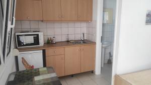 A kitchen or kitchenette at Cathrin Beach Apartments