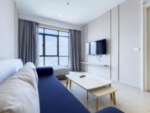 a living room with a couch and a table at I-City Hill10 Double Tree, Shah Alam - Smarthome in Kampong Padang Jawa