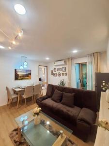 a living room with a couch and a table at 103 Condominium 2, 2 bedroom in Chiang Mai