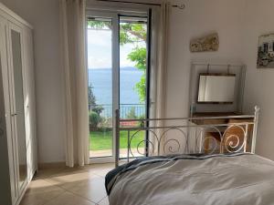 Posteľ alebo postele v izbe v ubytovaní Amfiteatrico Sea View - Kalamos Attiki