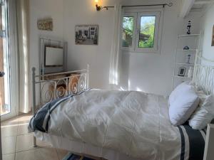 Posteľ alebo postele v izbe v ubytovaní Amfiteatrico Sea View - Kalamos Attiki