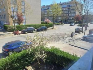 a street with cars parked in a parking lot at Cosy -confort appartment in Antwerp