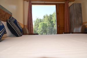 Fotografie z fotogalerie ubytování Himvan Stays v destinaci Mundaghat 