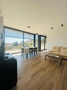 a living room with a couch and a table at La casa dell'orto in Imperia