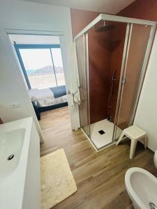 a bathroom with a shower and a toilet and a sink at La casa dell'orto in Imperia +30 photos