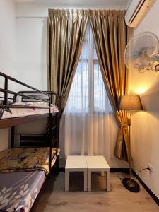 a bedroom with two bunk beds and a window at Homely Stay by MySky Stays at Presint 5, Putrajaya in Putrajaya +9 photos
