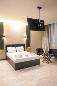 A bed or beds in a room at ZOOM HOTEL