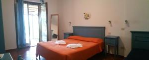 Voodi või voodid majutusasutuse Hotel Il Cipresso toas