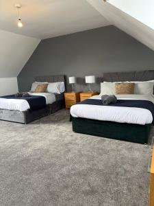 two beds in a room with two beds sidx sidx sidx at Sunderland Castle Free Parking in Sunderland