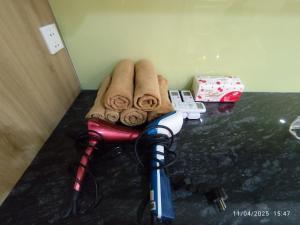 a room with a camera and towels on a counter at Nhà Nắng Vàng in Hai Phong