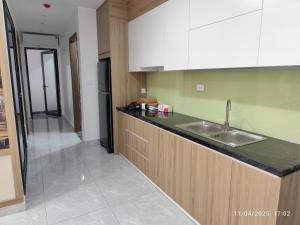 a kitchen with a sink and a counter top at Nhà Nắng Vàng in Hai Phong